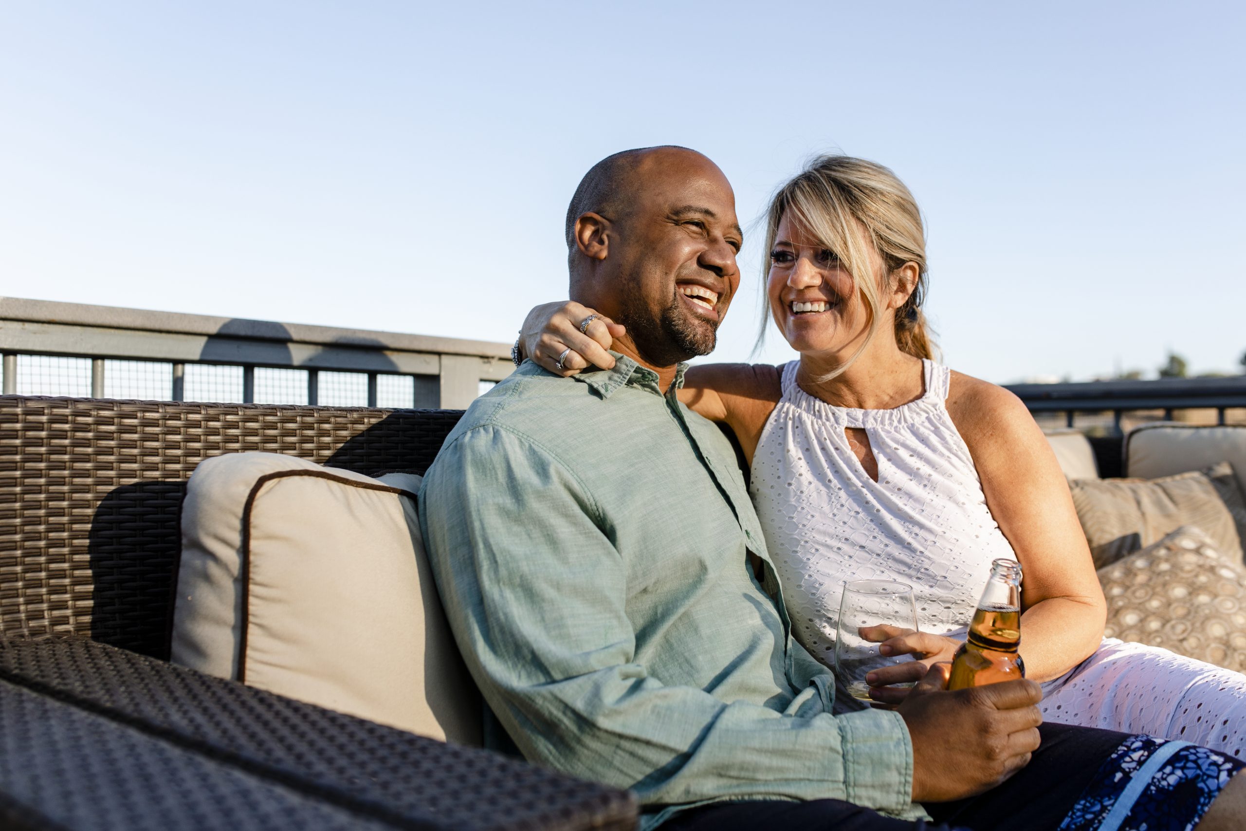 husband and wife relaxing on their rooftop during covid 19 lockd