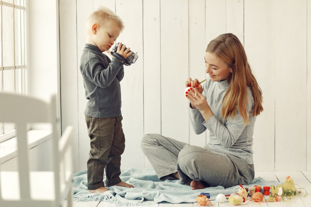 mother with son at home prepare to easter
